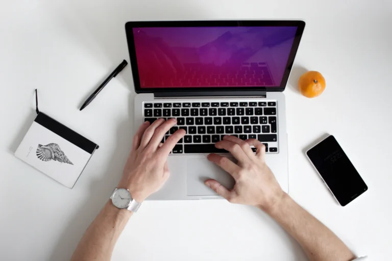 Writing website content on a laptop